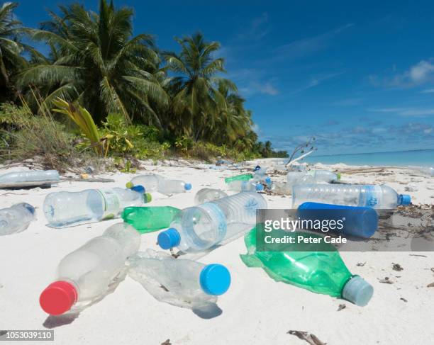 plastic washed up on tropical island - plastic pollution beach stock pictures, royalty-free photos & images