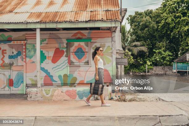 a tourist walking with graffitti on background - mexican street market stock pictures, royalty-free photos & images