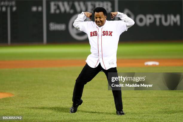 Former Boston Red Sox pitcher Pedro Martinez throws out the ceremonial first pitch with his former teammates prior to Game Two of the 2018 World...