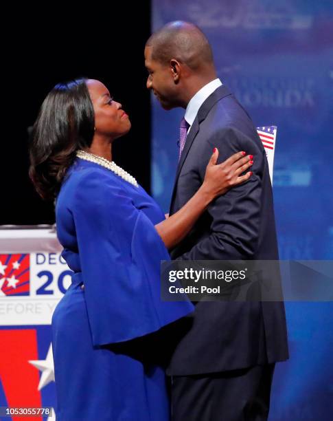 Democrat Andrew Gillum is embraced by his wife R. Jai after a debate against Republican Ron DeSantis at Broward College October 24, 2018 in Davie,...