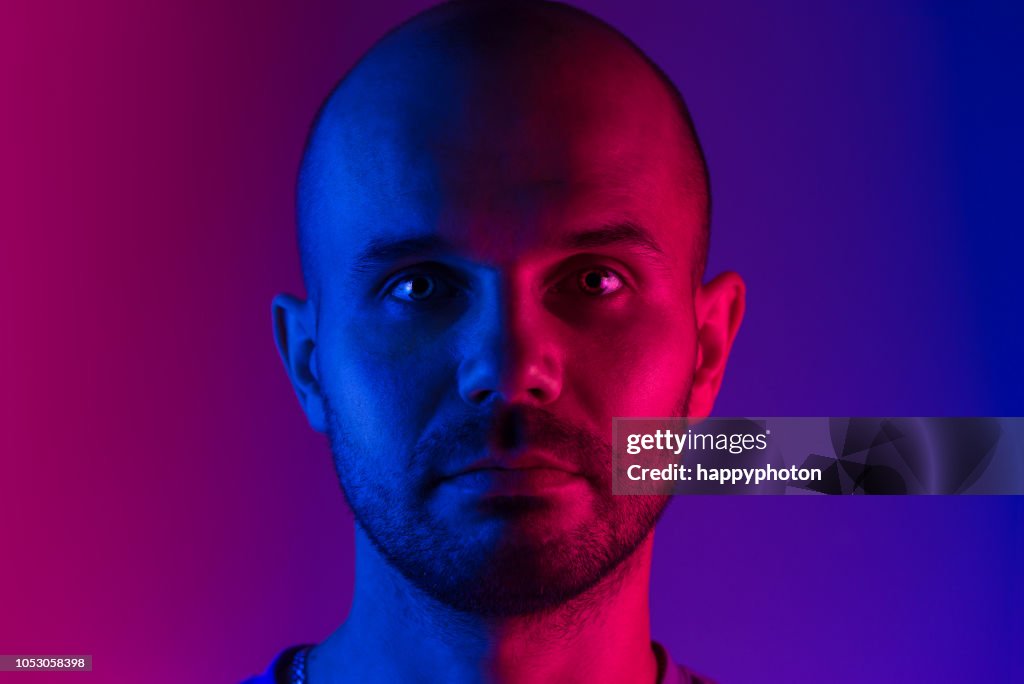 Portrait of a man. Dual tone lighting theme