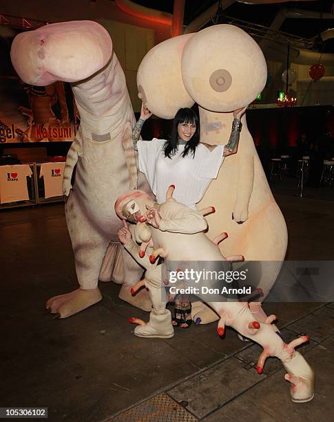 Sexpo performer Michelle Bombshell McGee poses alongside human appendage models at Sexpo 2010 at Hordern Pavilion on October 14, 2010 in Sydney,...