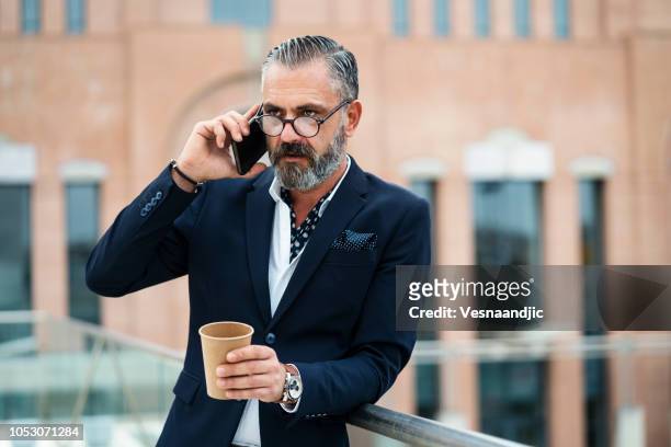 businessman with style - monocle stock pictures, royalty-free photos & images