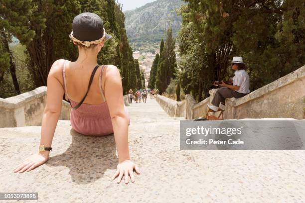 woman relaxing at top of path in palma - pollenca steps stock pictures, royalty-free photos & images