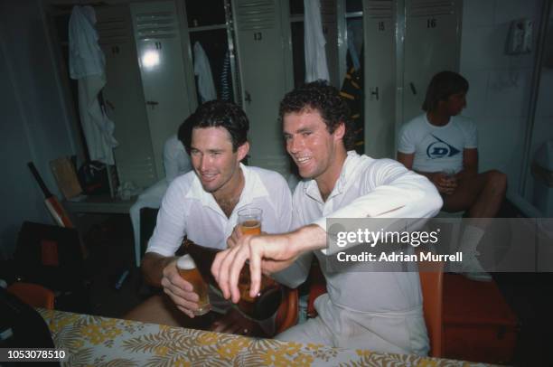 Australian team captain Greg Chappell enjoying a beer with team mate John Dyson in the dressing room during the First Ashes Test against England at...