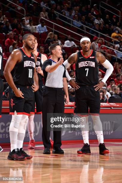 Carmelo Anthony of the Houston Rockets talks with NBA referee JB DeRosa during the game against the Utah Jazz on October 24, 2018 at Toyota Center,...