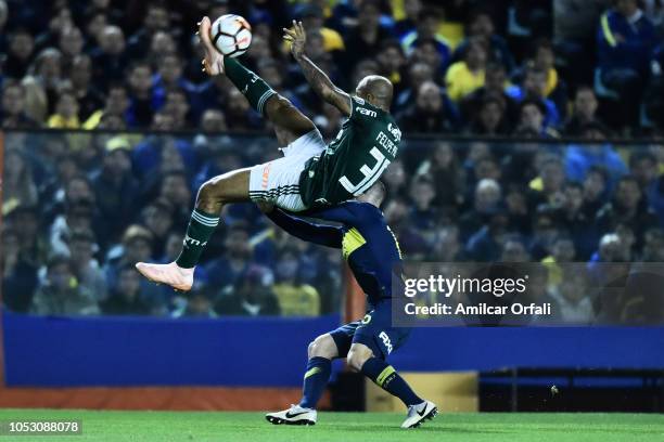 Felipe Melo of Palmeiras kicks the ball in the air against Nahitan Nandez of Boca Juniors during a match between Boca Juniors and Palmeiras as part...