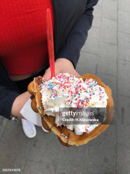 bubble waffle with ice cream and whipped cream - ice cream cone stock-fotos und bilder