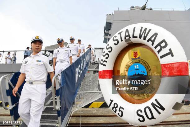 This photo taken on October 24, 2018 shows Chinese sailors visiting Singapore Navy's frigate RSS Stalwart during the ASEAN-China Maritime Exercise at...