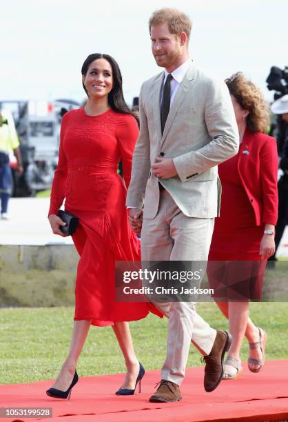 Prince Harry, Duke of Sussex and Meghan, Duchess of Sussex arrive at Fua'amotu Airport on October 25, 2018 in Nuku'alofa, Tonga. The Duke and Duchess...