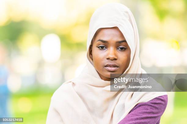 muslim black young woman - sénégal migration stock pictures, royalty-free photos & images