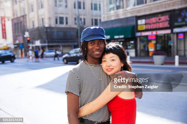 Young couple hugging on a city street