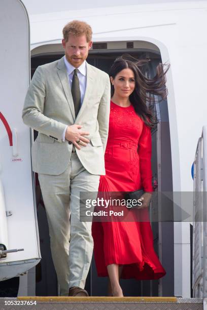 Prince Harry, Duke of Sussex and Meghan, Duchess of Sussex arrive at Fua'amotu Airport on October 25, 2018 in Nuku'Alofa, Tonga. The Duke and Duchess...