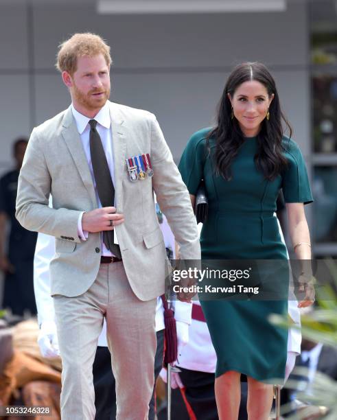 Prince Harry, Duke of Sussex and Meghan, Duchess of Sussex attend an official welcome ceremony and unveil a new statue commemorating Sergeant...