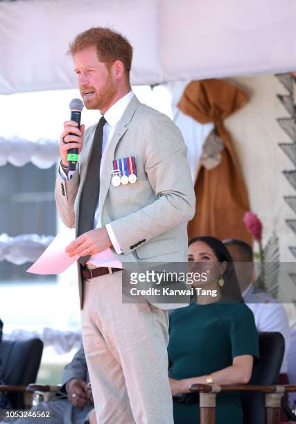 Prince Harry, Duke of Sussex and Meghan, Duchess of Sussex attend an official welcome ceremony and unveil a new statue commemorating Sergeant...