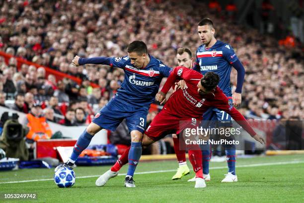 Crvena Zvezda midfielder Branko Jovicic fights for the ball against Liverpool forward Roberto Firmino during the Uefa Champions League Group Stage...