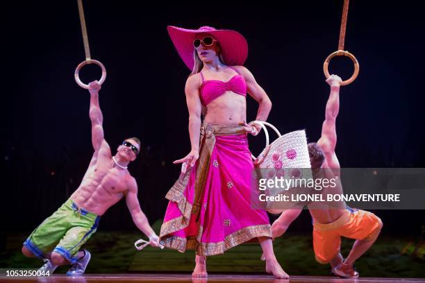 Members of the Canadian circus troop 'Le Cirque du Soleil' perform during the show "Totem" in Paris on October 24, 2018. - The show "Totem" will run...