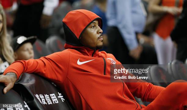 Carmelo Anthony of the Houston Rockets looks on from the bench during warm ups against the Indiana Pacers at Toyota Center on October 4, 2018 in...