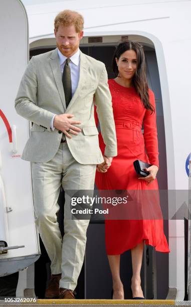 Prince Harry, Duke of Sussex and Meghan, Duchess of Sussex arrive at Nuku'alofa airport on October 25, 2018 in Nuku'alofa, Tonga. The Duke and...