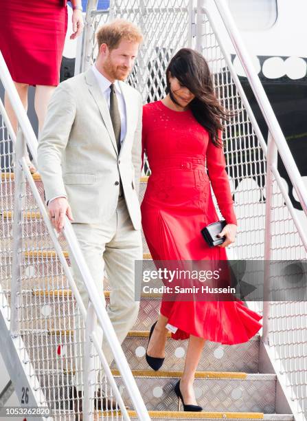 Prince Harry, Duke of Sussex and Meghan, Duchess of Sussex arrive at Nuku'alofa airport on October 25, 2018 in Nuku'alofa, Tonga. The Duke and...