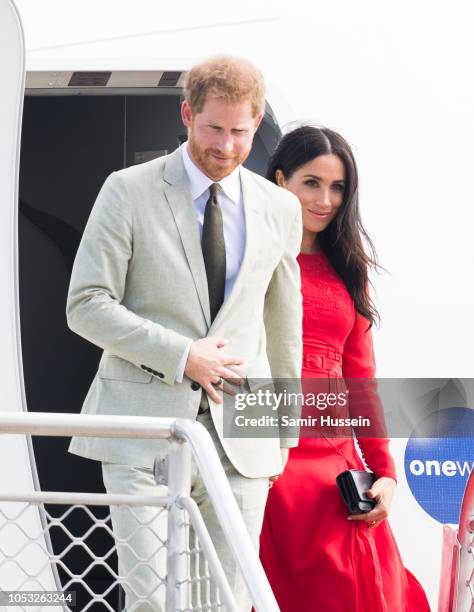 Prince Harry, Duke of Sussex and Meghan, Duchess of Sussex arrive at Nuku'alofa airport on October 25, 2018 in Nuku'alofa, Tonga. The Duke and...
