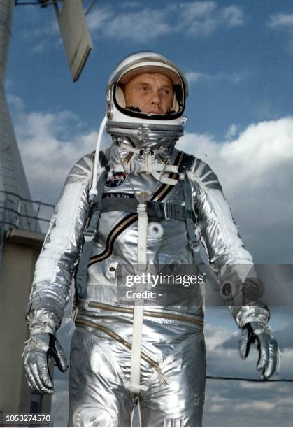 This file photo dated February 1962 shows US astronaut John Glenn wearing a Mercury pressure suit during training for his 20 Feburary 1962 space...