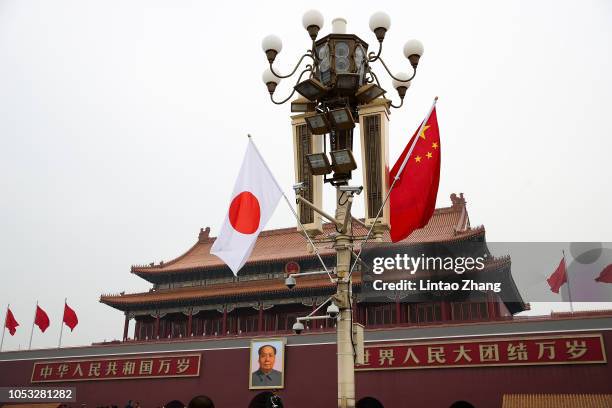 National flags of China and Japan fly in Tian'anmen Square to welcome Japanese Prime Minister Shinzo Abe on October 25, 2018 in Beijing, China. At...