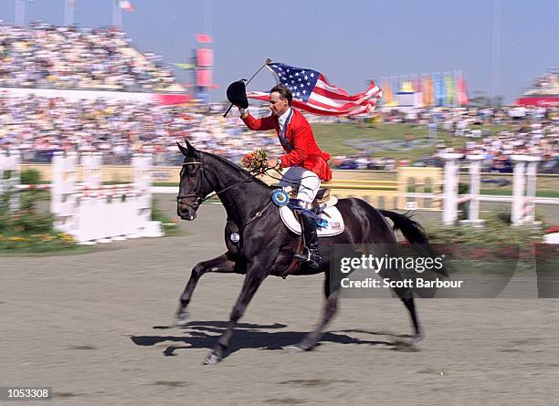 David O''Connor of the USA aboard Custom Made celebrates his Gold Medal win in the Individual Three Day Event Show Jumping at the Sydney...