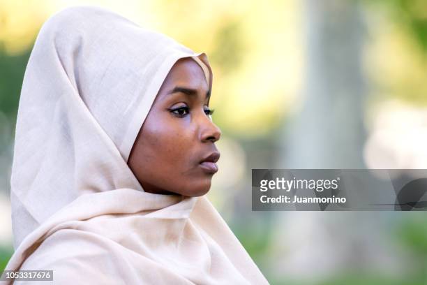 muslim black young woman - sénégal migration stock pictures, royalty-free photos & images