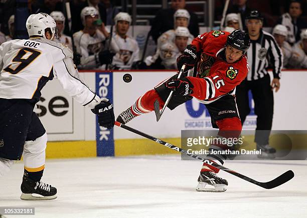 Fernando Pisani of the Chicago Blackhawks shoots the puck past Marcel Goc of the Nashville Predators at the United Center on October 13, 2010 in...