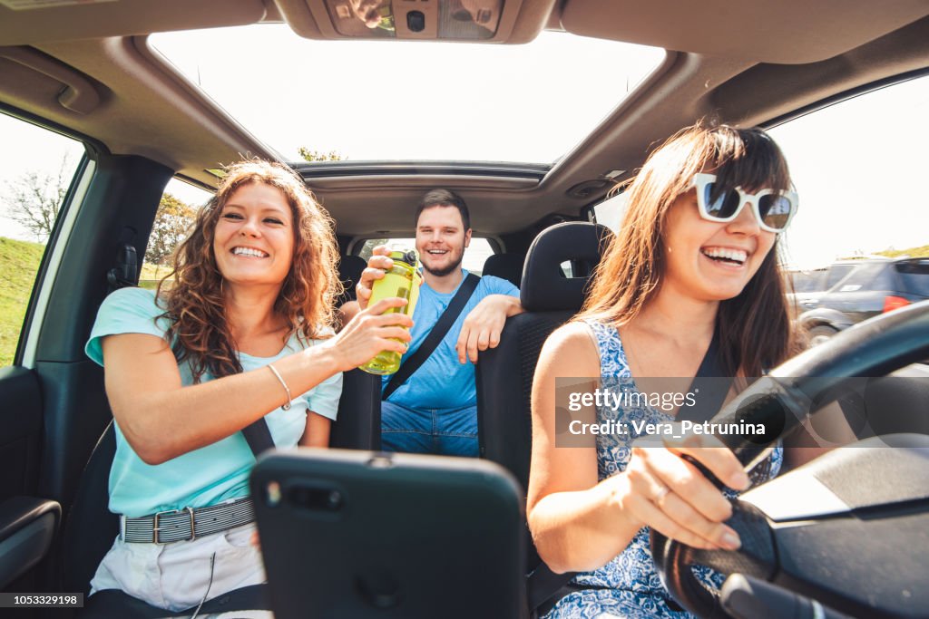 Group of people travel by car.