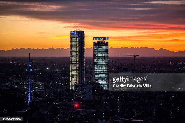 General view of Allianz tower and Generali tower at sunset on October 24, 2018 in Milan, Italy. The phenomenon is caused by the Föhn, a dry wind that...