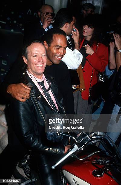 Peter Fonda and O.J. Simpson during Grand Opening of The Harley Davidson Cafe at Harley Davidson Cafe in New York City, New York, United States.
