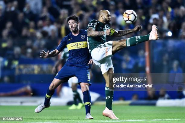 Pablo Perez of Boca Juniors fights for the ball with Felipe Melo of Palmeiras during the Semi Final first-leg match between Boca Juniors and...