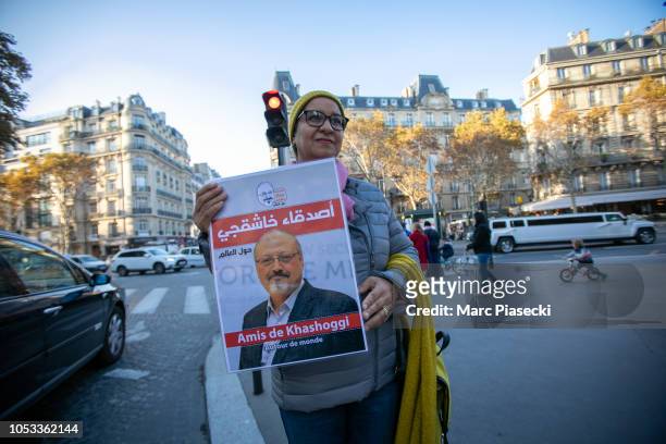 Demonstrator holds a sign protesting over the killing of Jamal Khashoggi, the Saudi journalist allegedly murdered at Saudi Arabia's Istanbul...