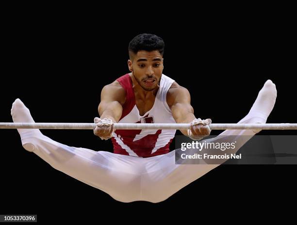 Ahmed Mosa of Qatar competes in Men's Horizontal Bar Qualification during day one of the 2018 FIG Artistic Gymnastics Championships at Aspire Dome on...