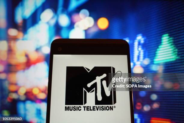 In this photo illustration, the logo of music television is seen displayed on a smartphone.