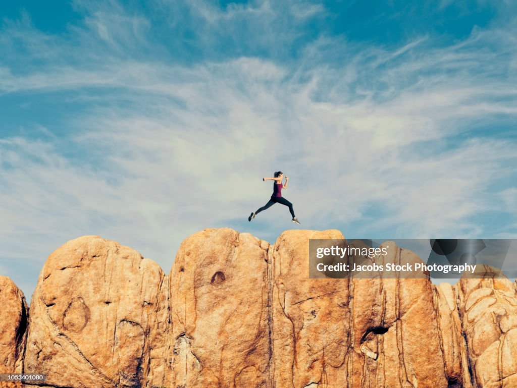 Leap Over Rocks Woman Leaping Over Rocks High-Res Stock Photo - Getty Images