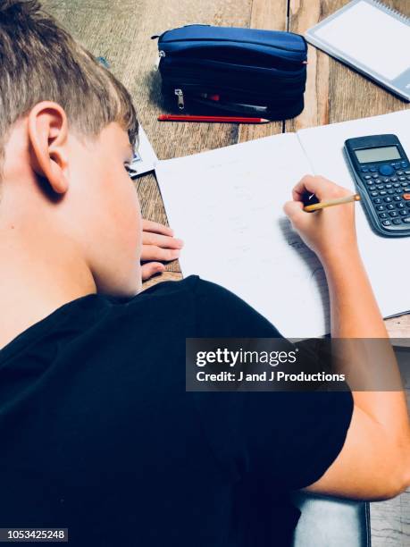 boy doing homework - math homework stock pictures, royalty-free photos & images