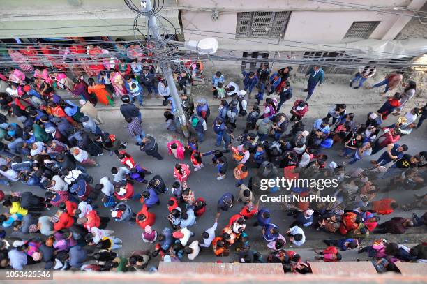 Nepalese people participate in the festival as Locals carry and rotates top part of a chariot of Lord Narayan across the streets of Hadigaun during...