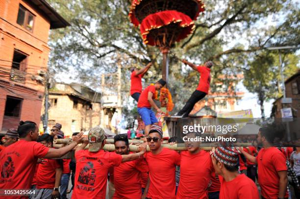 Locals carry as well as rotates top part of a chariot of Lord Narayan across the streets of Hadigaun during Lord Narayan jatra festival in Hadigaun,...