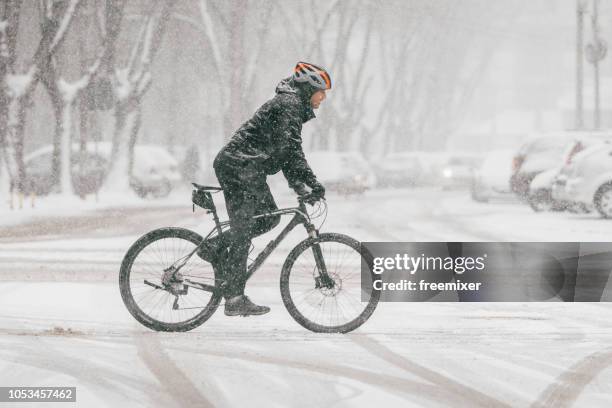 bicycle on the snow - snow scene stock pictures, royalty-free photos & images