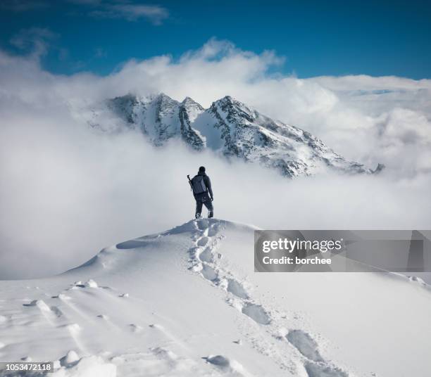 hiking in the mountains - snow stock pictures, royalty-free photos & images