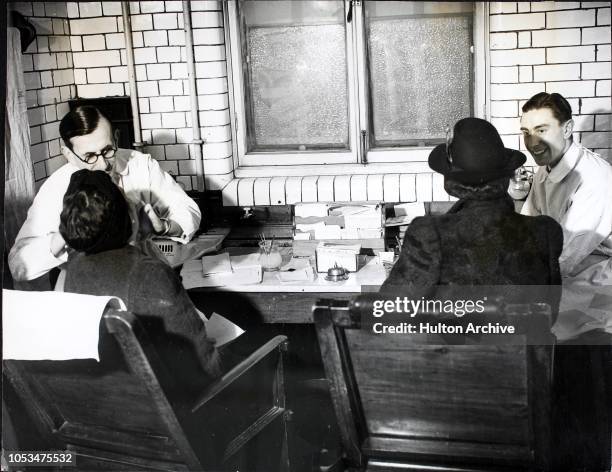 New patients being examined in the examination room at the Dental School of the University College Hospital, where full particulars of their dental...