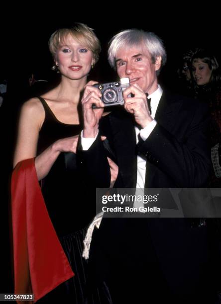 Andy Warhol and guest during Janet Auchincloss Sighting in New York City - December 1, 1982 in New York City, New York, United States.