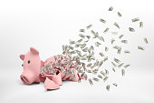 3d rendering of a pink broken piggy bank lying on a white background with many dollar banknotes flying out of it.