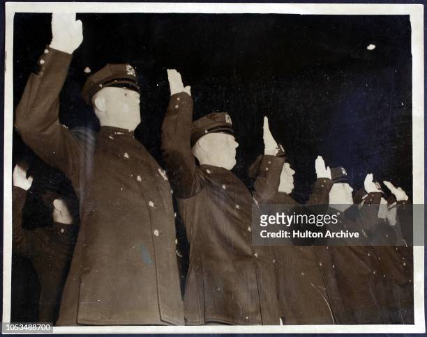 New police officers taking the oath of allegiance at their graduation ceremony, in preparation for the World's Fair, New York City, 31st December...