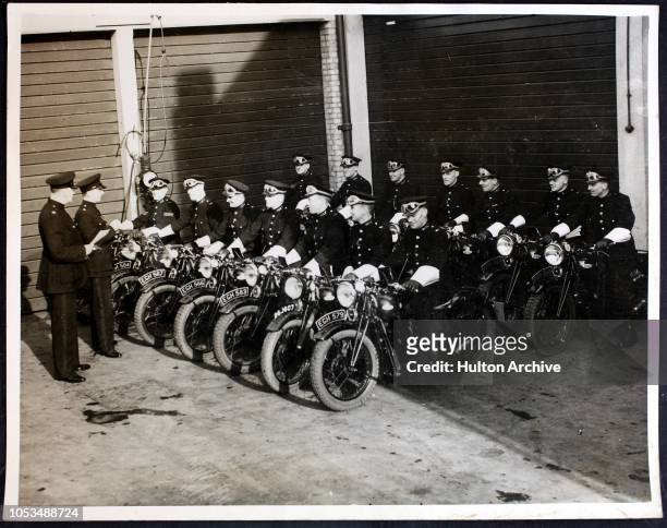 Fourteen of the new Metropolitan Police motorcycle officers named the 'courtesy squads', take to the roads for the first time, UK, 4th April 1938....