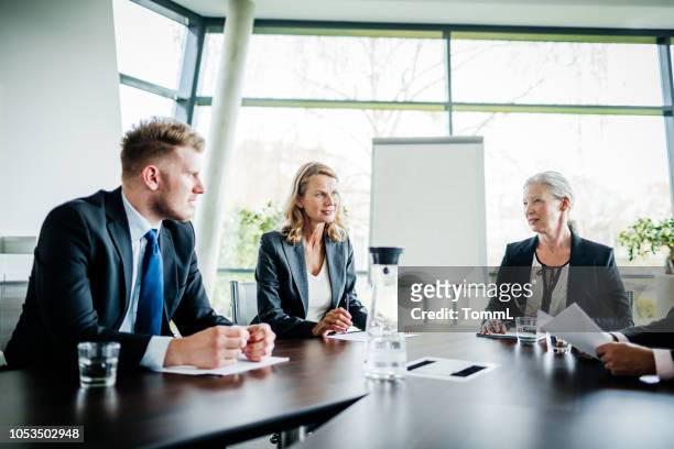 business meeting between shareholders and managers - shareholder stock pictures, royalty-free photos & images