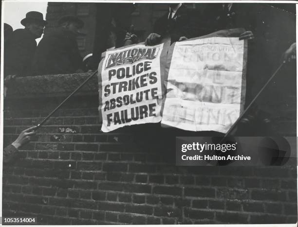 Poster from the National News announces the police strike to be an 'absolute failure', at a meeting on Tower Hill, London, England.